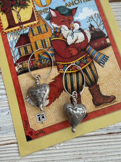 Stamped fine silver heart earrings.