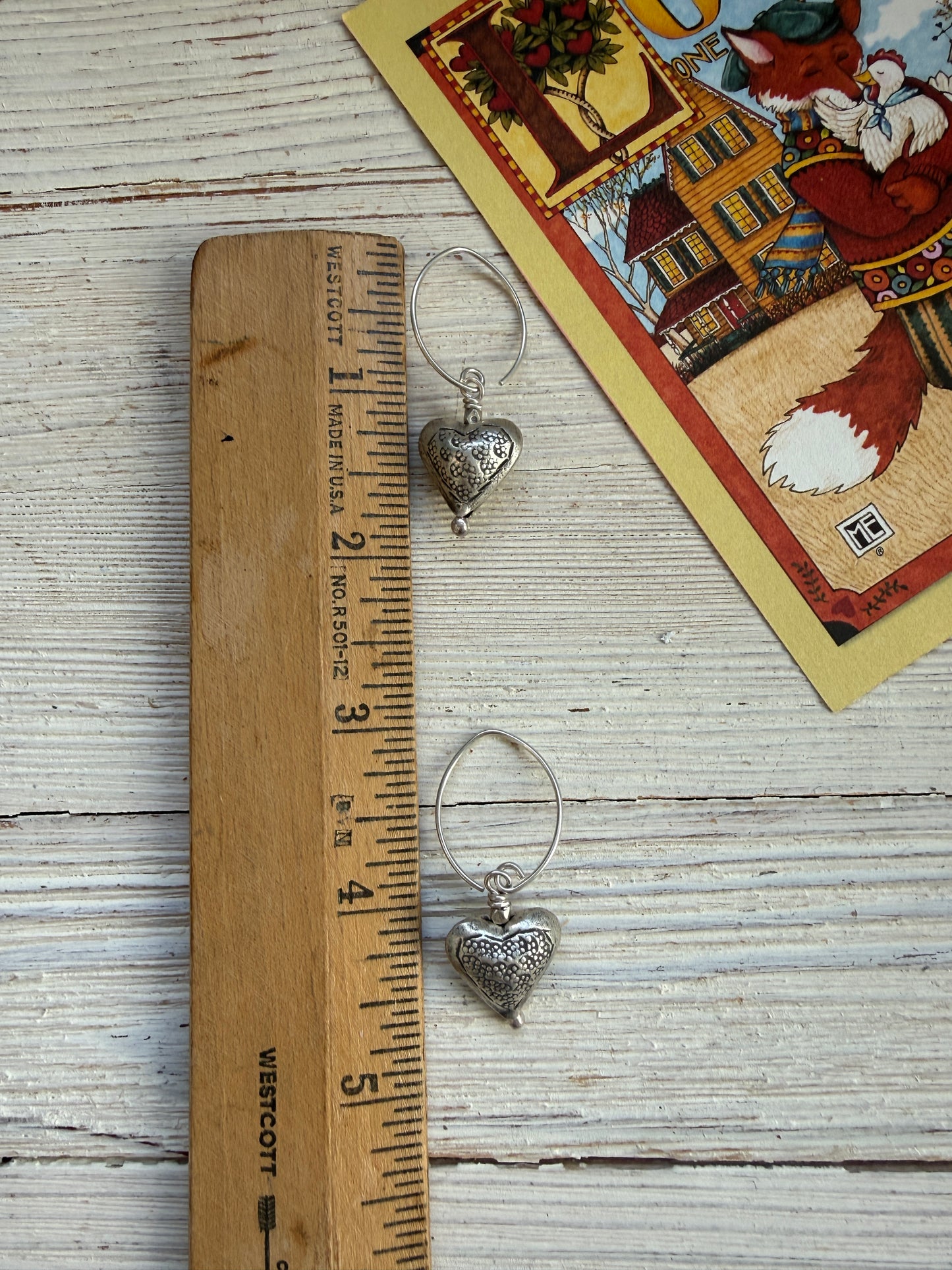 Stamped fine silver heart earrings.