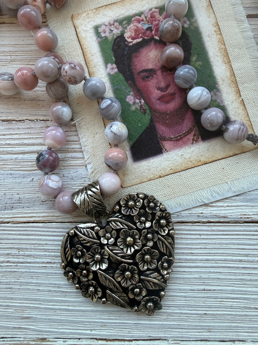 Tibetan flowered heart pendant on pink Botswana agates long necklace.