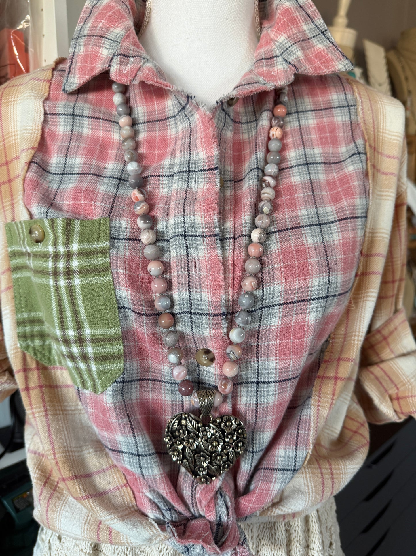 Tibetan flowered heart pendant on pink Botswana agates long necklace.