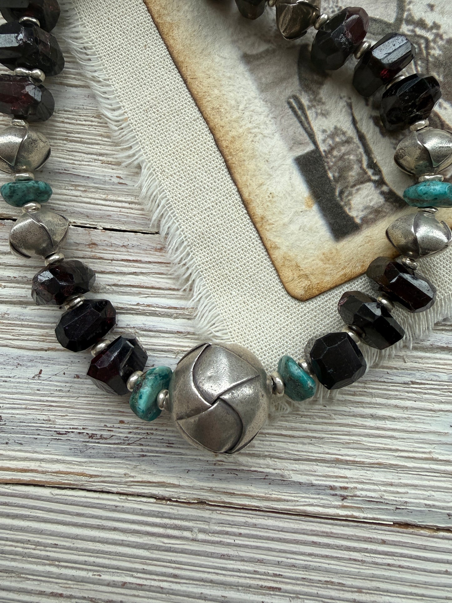 Faceted garnets with fine silver origami beads and turquoise necklace.