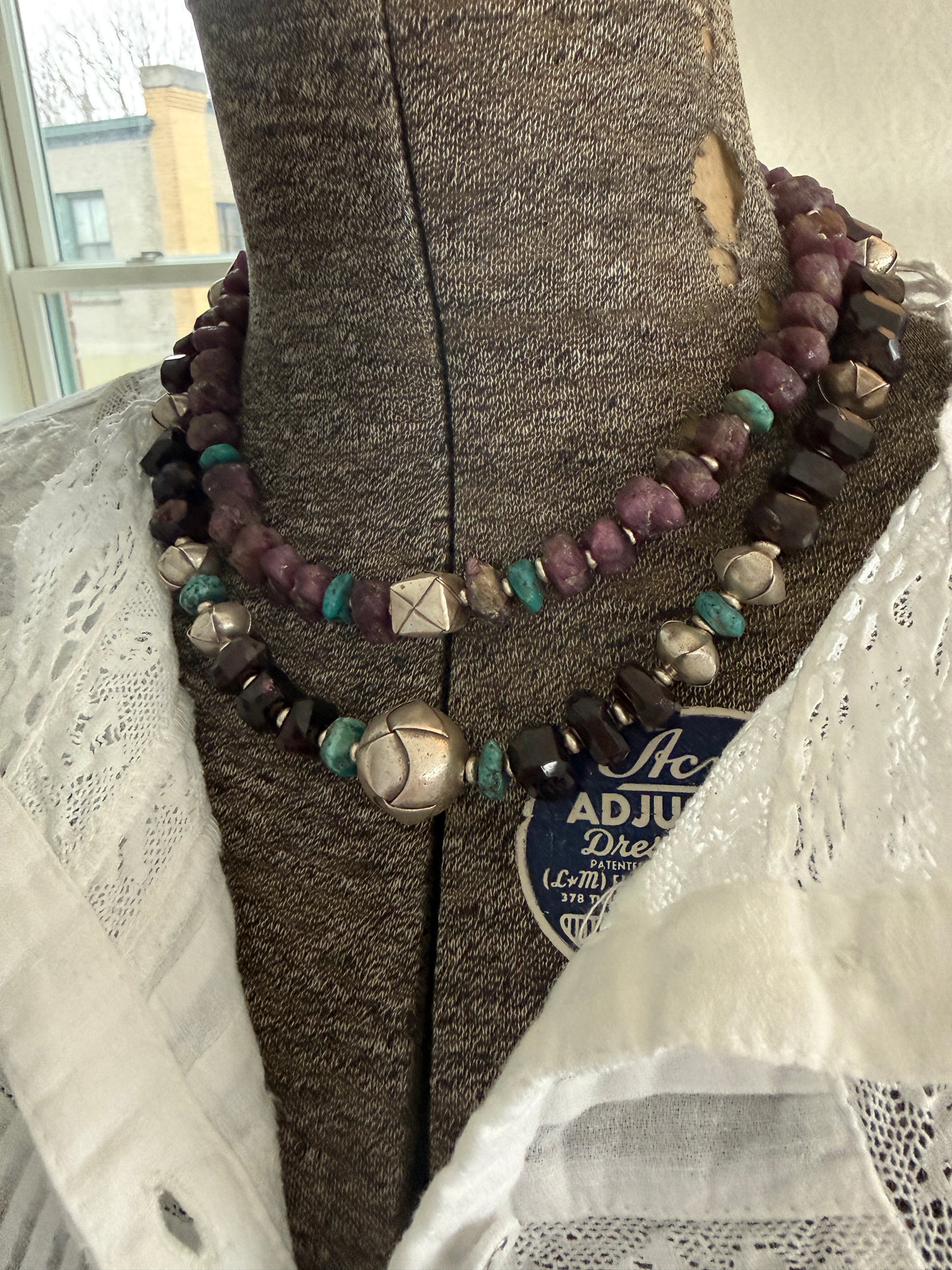 Faceted garnets with fine silver origami beads and turquoise necklace.