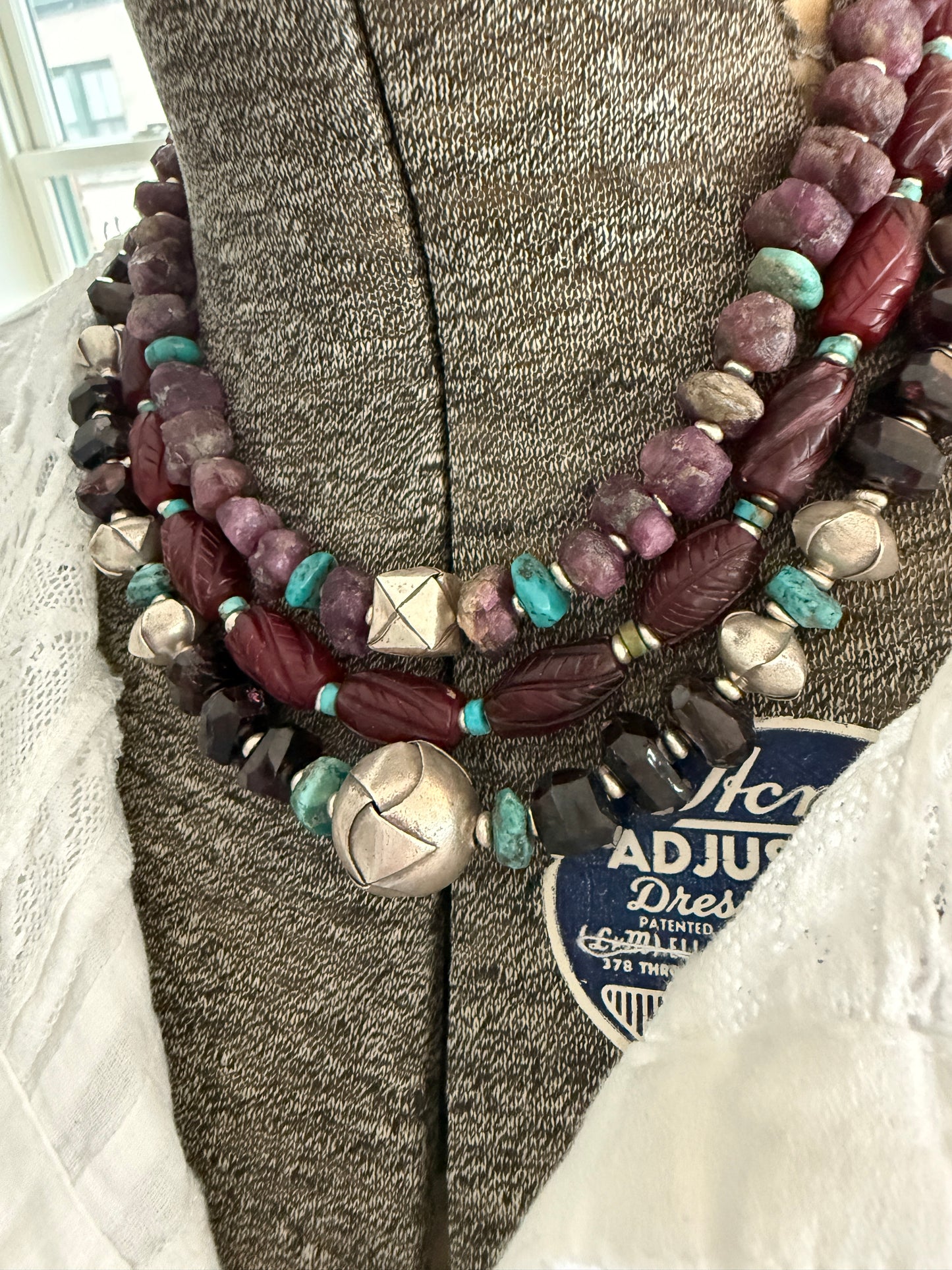 Faceted garnets with fine silver origami beads and turquoise necklace.