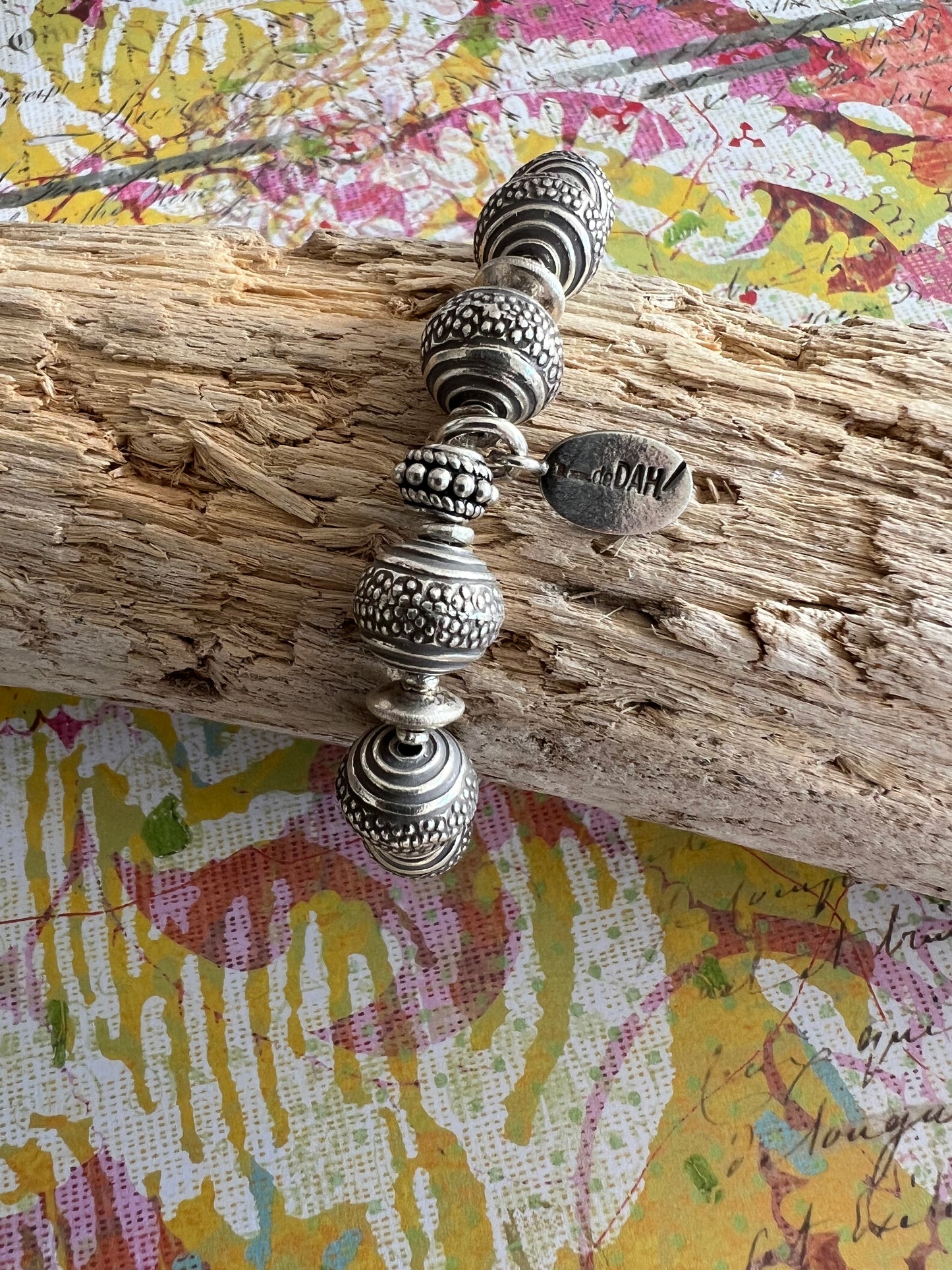 Textured fine silver rounds stretch stack bracelet. Fits 6-6.5” wrist.