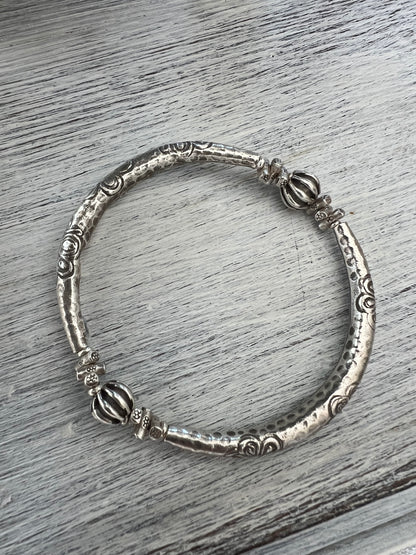 Fine silver bangle with stamped flowers. Bohemian stretch stacker bracelet.