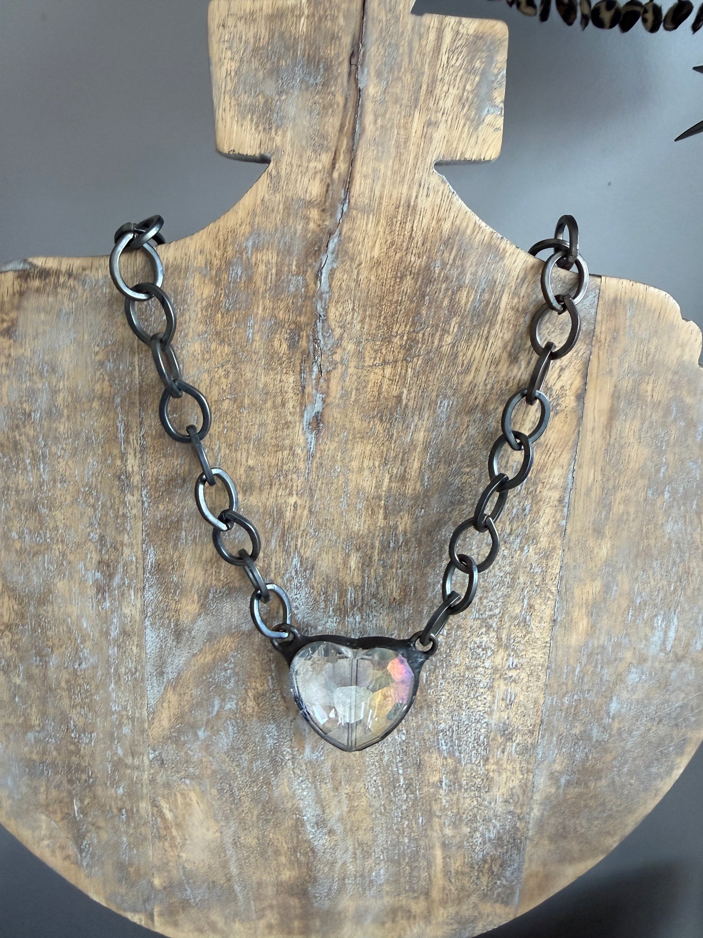 Prism crystal heart on gunmetal base metal chain necklace.
