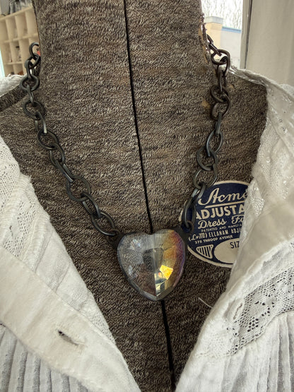 Prism crystal heart on gunmetal base metal chain necklace.