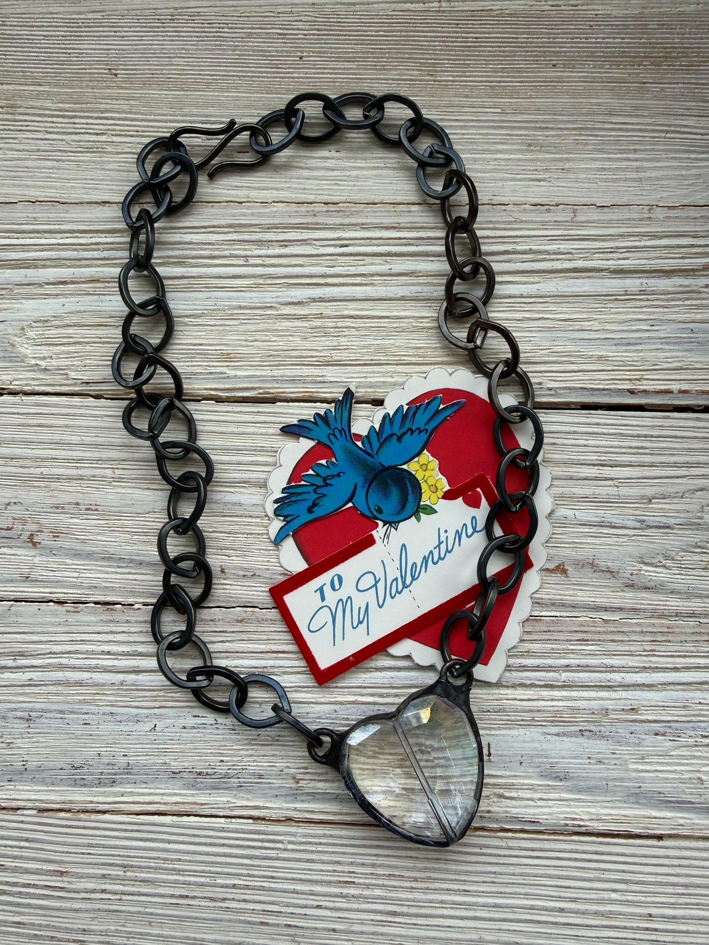Prism crystal heart on gunmetal base metal chain necklace.