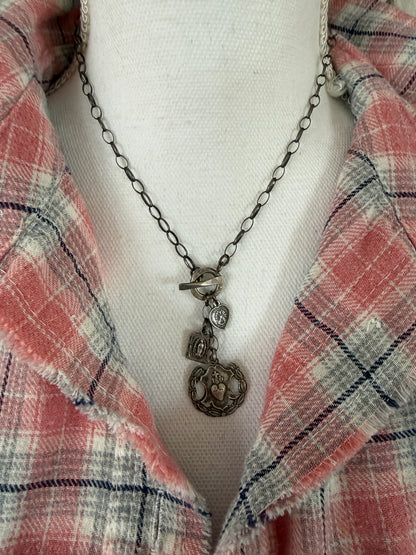 Oxidized sterling silver chain with sterling silver religious medals and fine silver front toggle necklace.