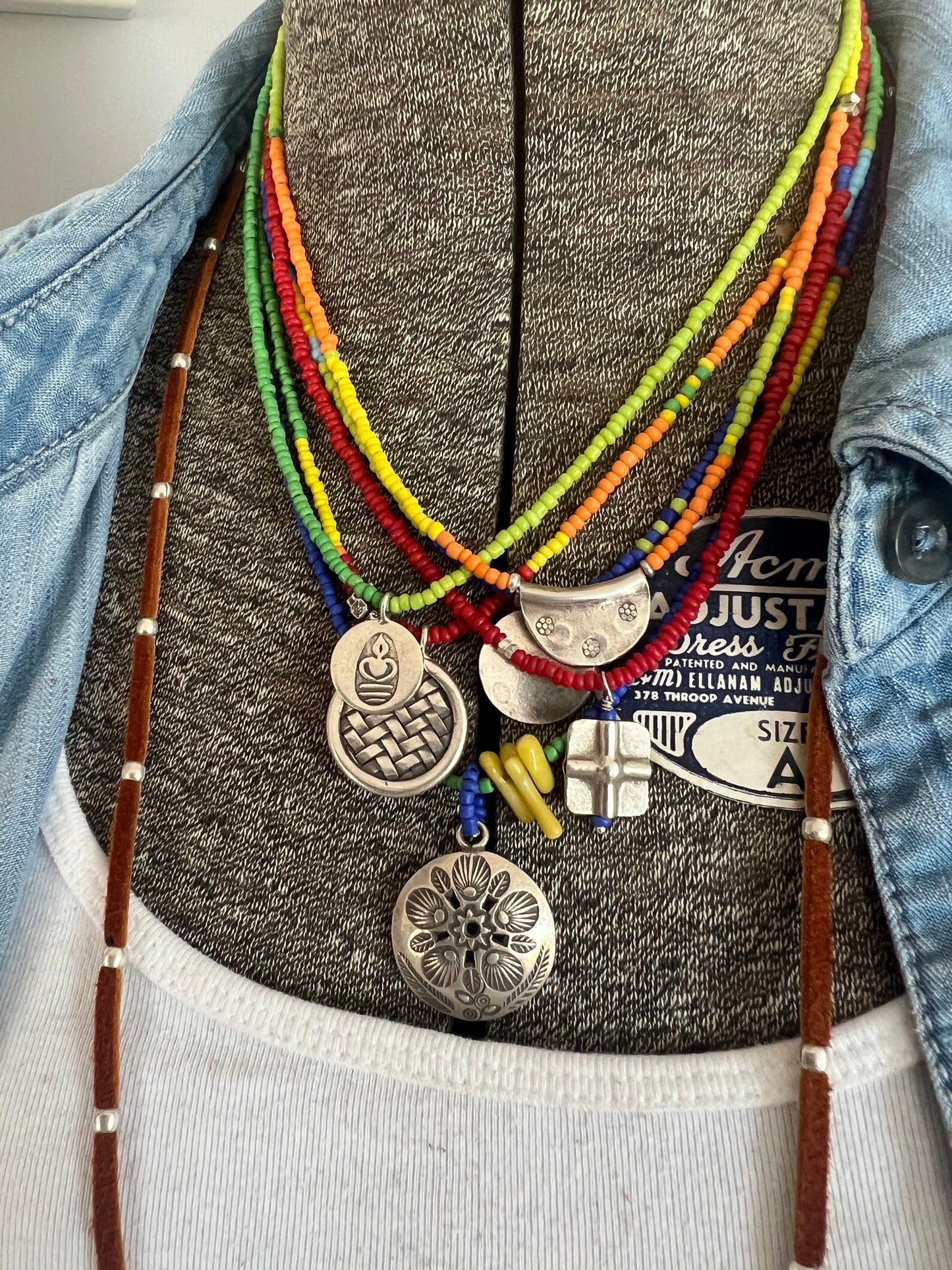 Stamped Thai pendant with colorful Java glass seed beads necklace.