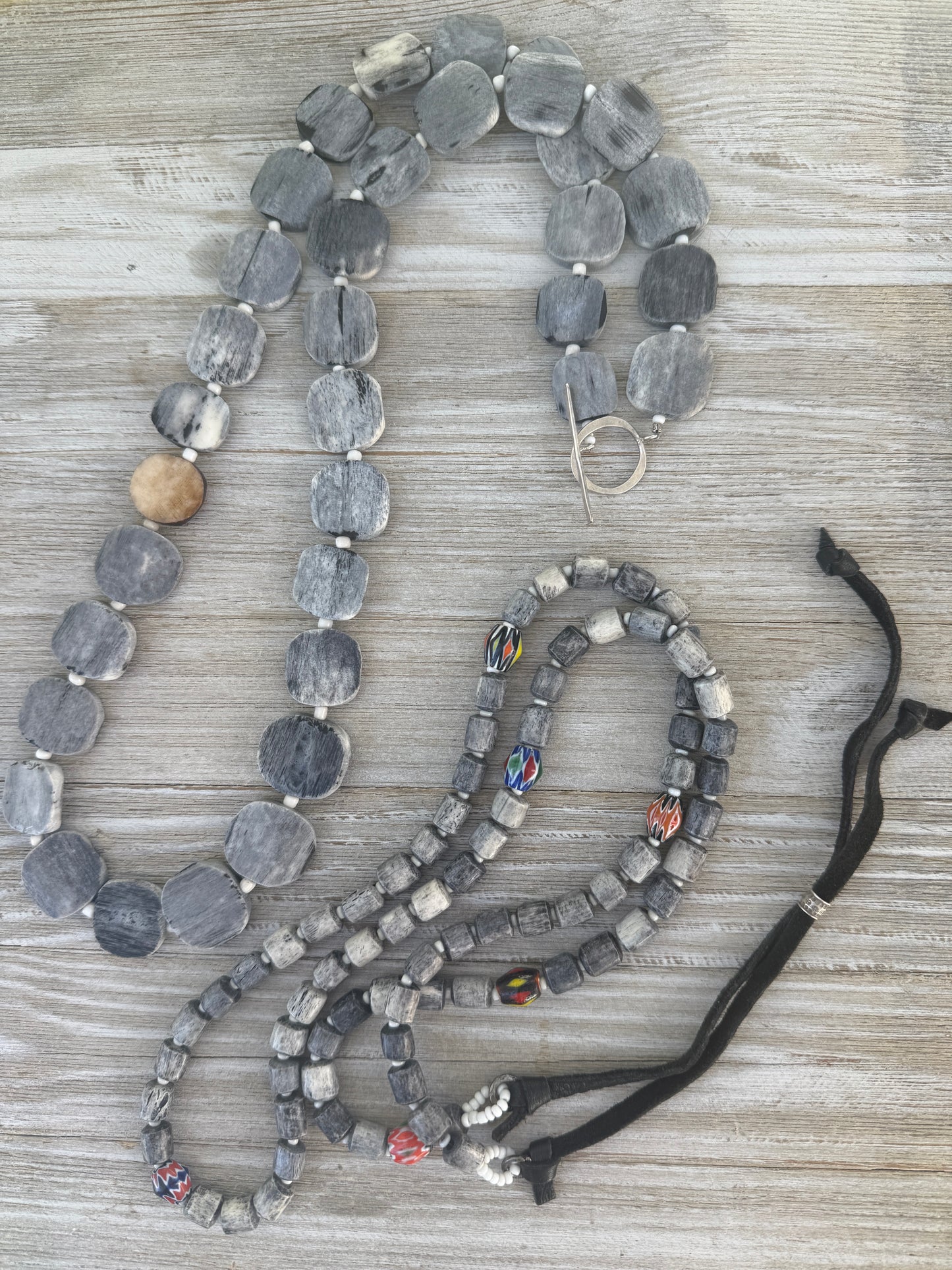 Dark grey bone coin long necklace with fine silver toggle. 35.75”
