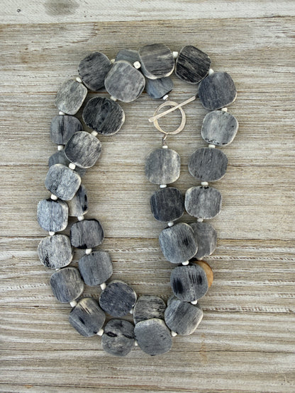 Dark grey bone coin long necklace with fine silver toggle. 35.75”