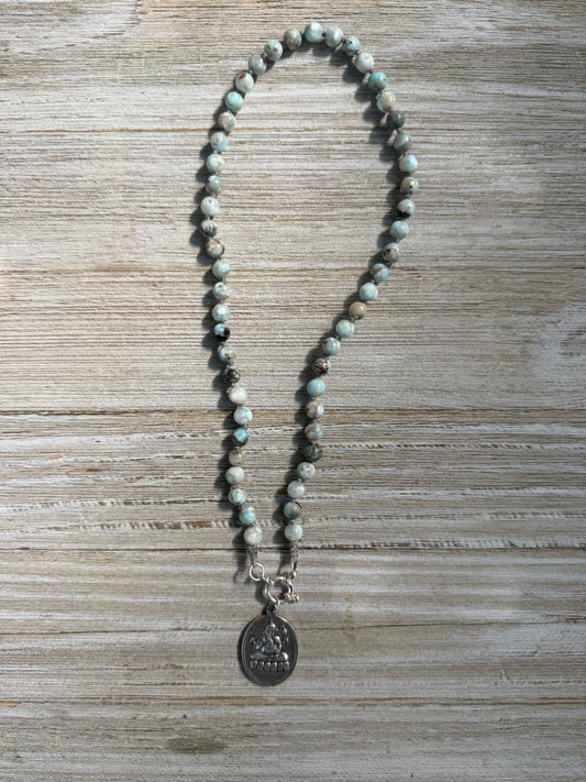 Blue larimar knotted necklace with sterling clasp and sterling ganesha pendant. 17”.