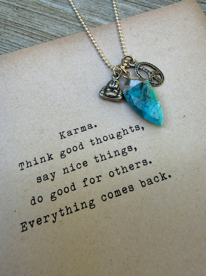 Turquoise spear with sterling Buddha and peace charms on sterling ball chain necklace. 18”