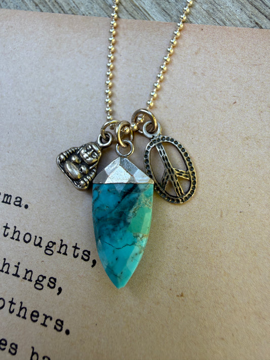 Turquoise spear with sterling Buddha and peace charms on sterling ball chain necklace. 18”