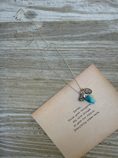 Turquoise spear with sterling Buddha and peace charms on sterling ball chain necklace. 18”