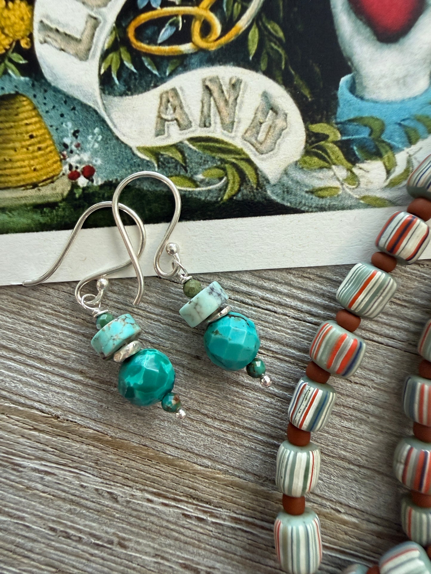 Tibetan turquoise pendant on striped Java beads. Fine silver hook clasp. 21”.