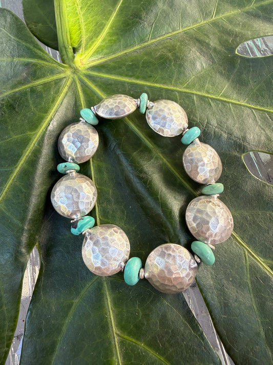Hammered fine silver pillow coins with turquoise stretch bracelet. 6.5”