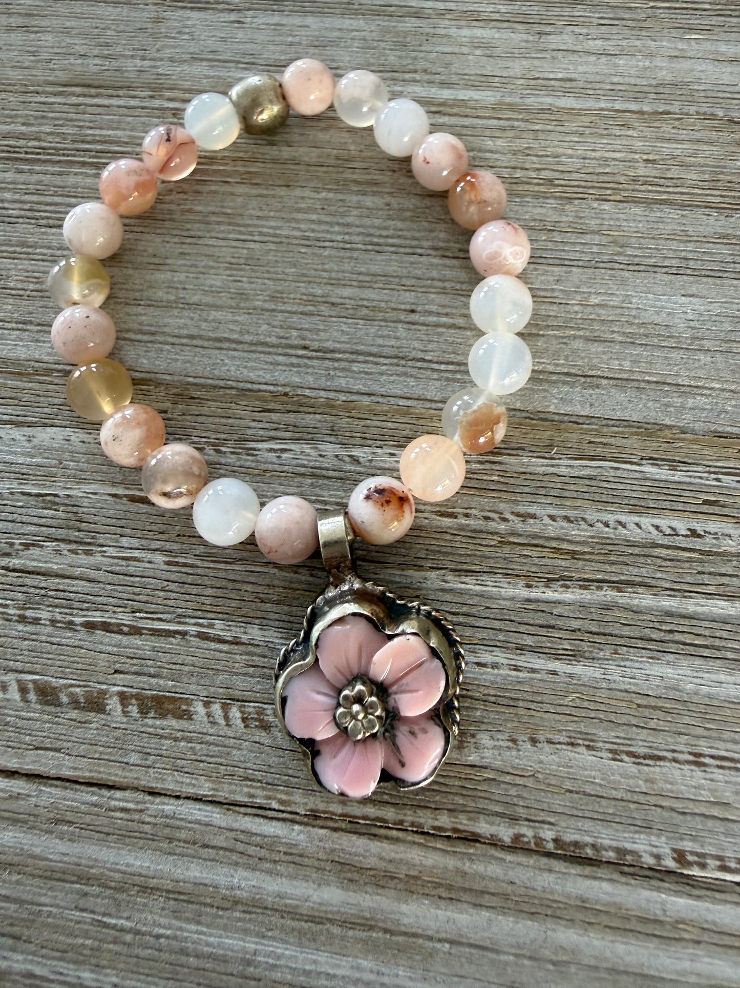 Tibetan pink Opal carved flower on cherry blossom agate stretch bracelet. 7”.