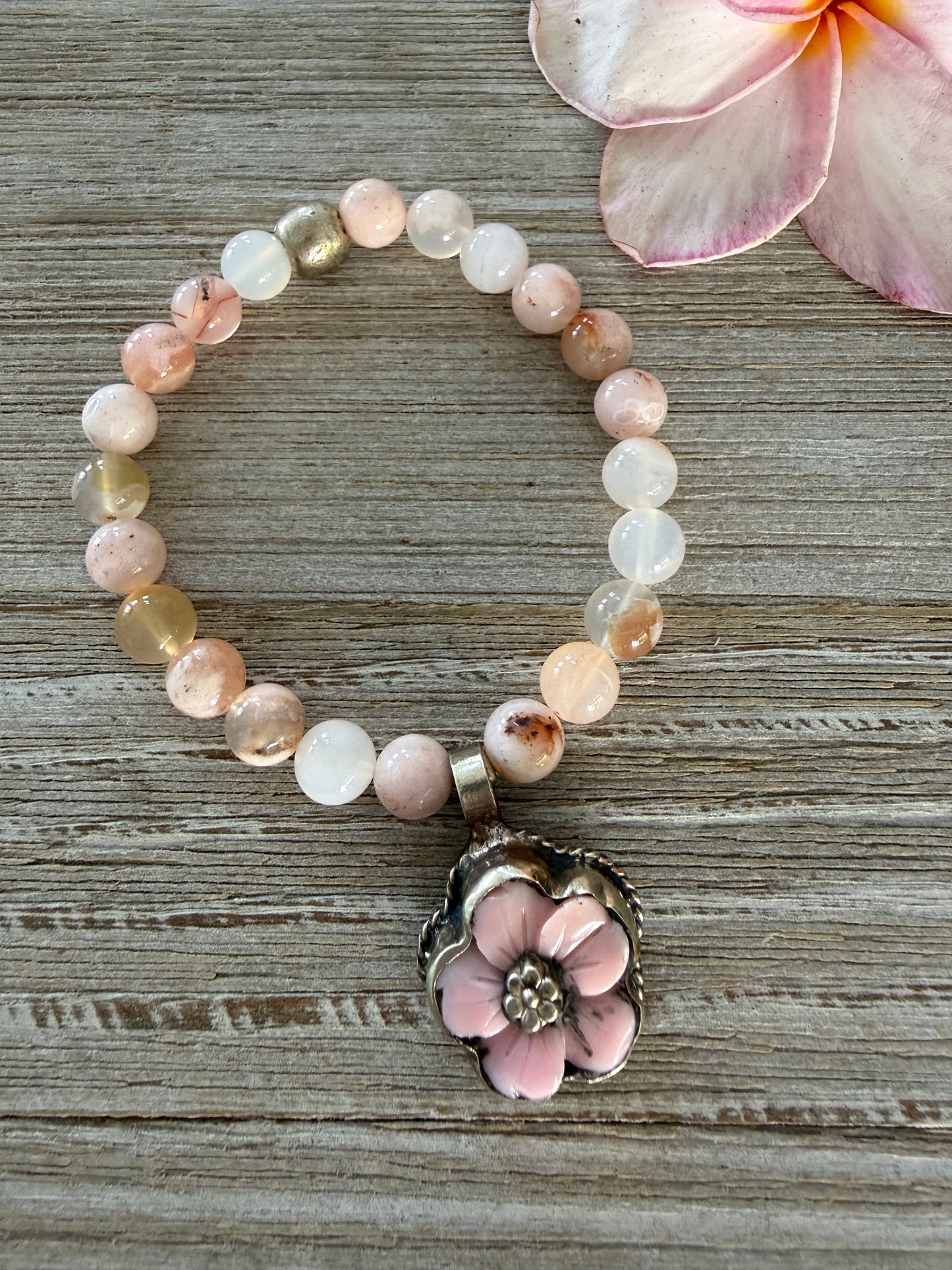 Tibetan pink Opal carved flower on cherry blossom agate stretch bracelet. 7”.