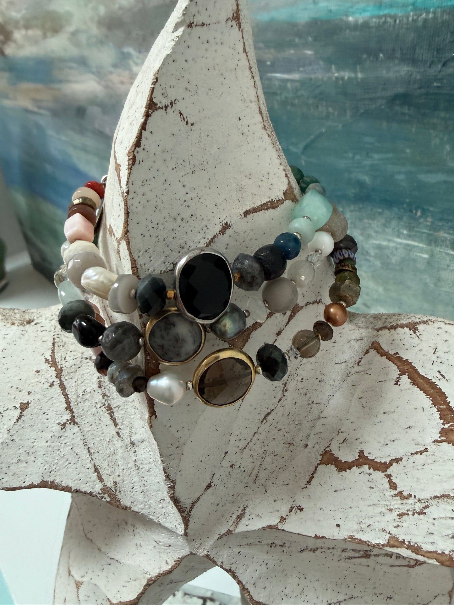 Mixed gemstone bracelet with black onyx focal bead and sterling clasp and extender chain. 6-7”