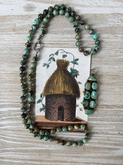 Green turquoise knotted necklace with Tibetan turquoise (removable) pendant. 34.25”.