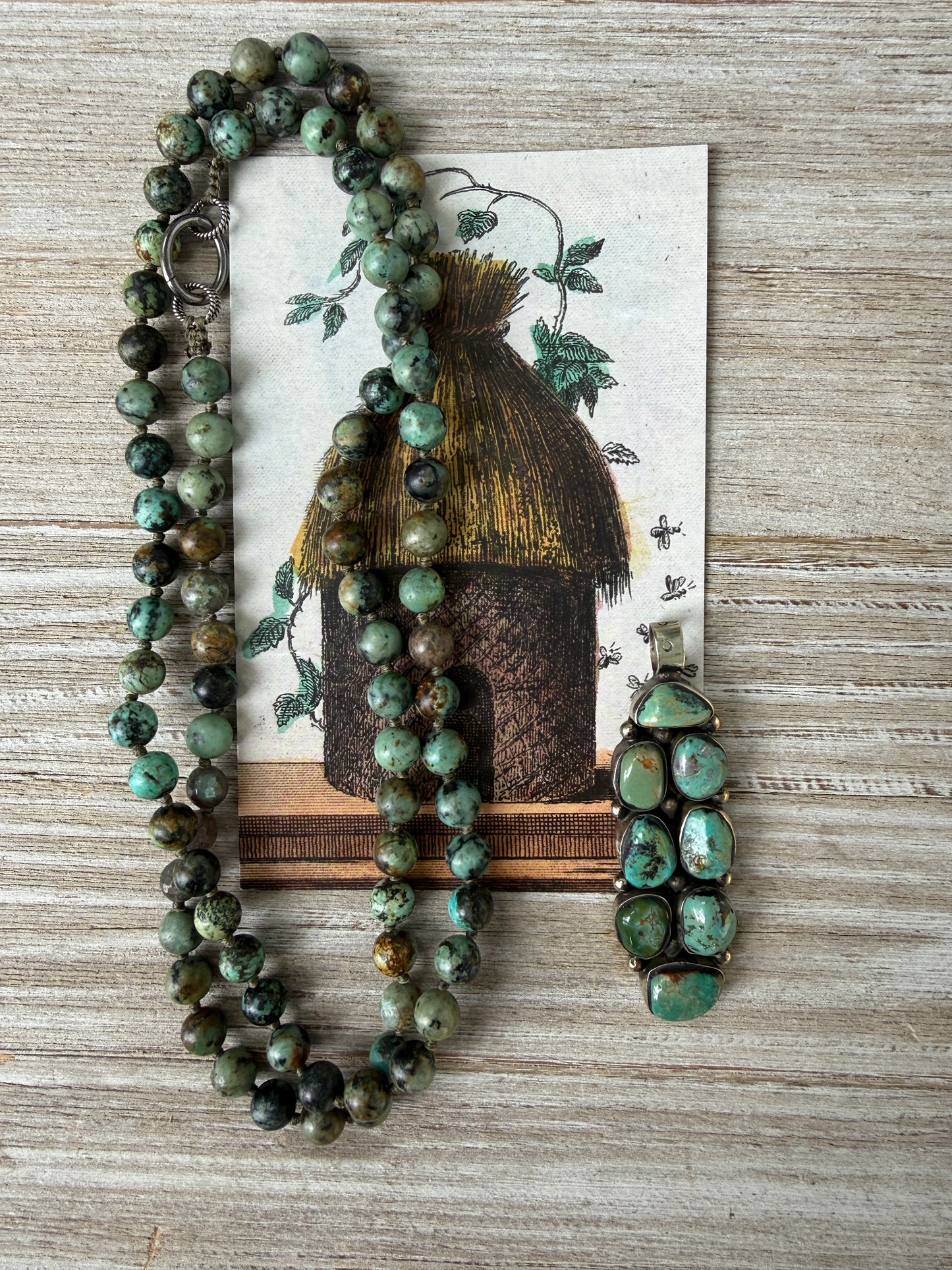 Green turquoise knotted necklace with Tibetan turquoise (removable) pendant. 34.25”.