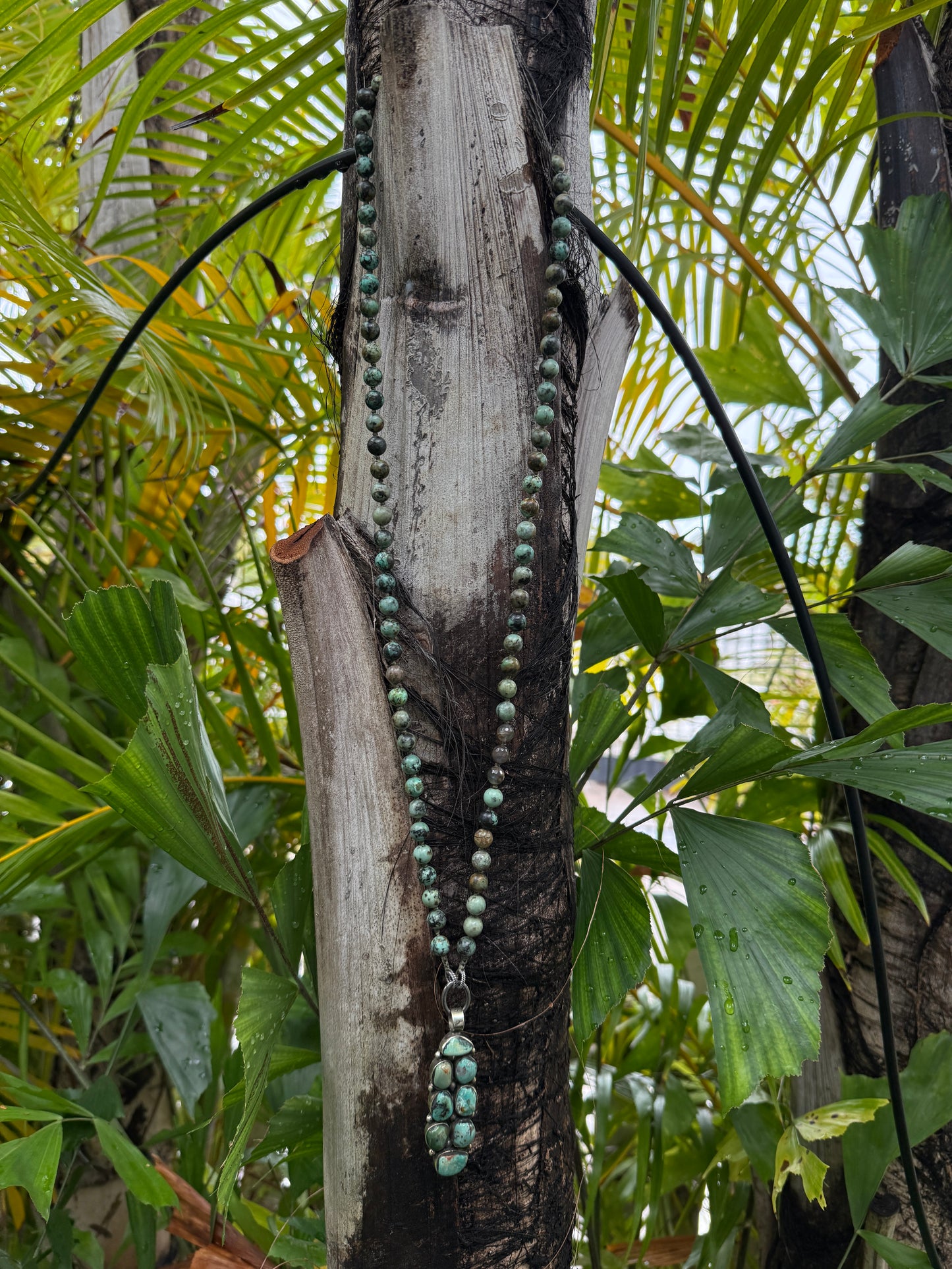 Green turquoise knotted necklace with Tibetan turquoise (removable) pendant. 34.25”.