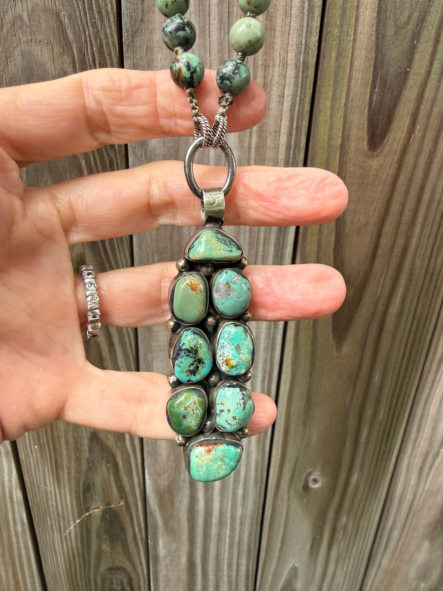 Green turquoise knotted necklace with Tibetan turquoise (removable) pendant. 34.25”.