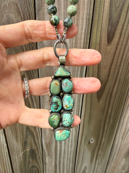 Green turquoise knotted necklace with Tibetan turquoise (removable) pendant. 34.25”.