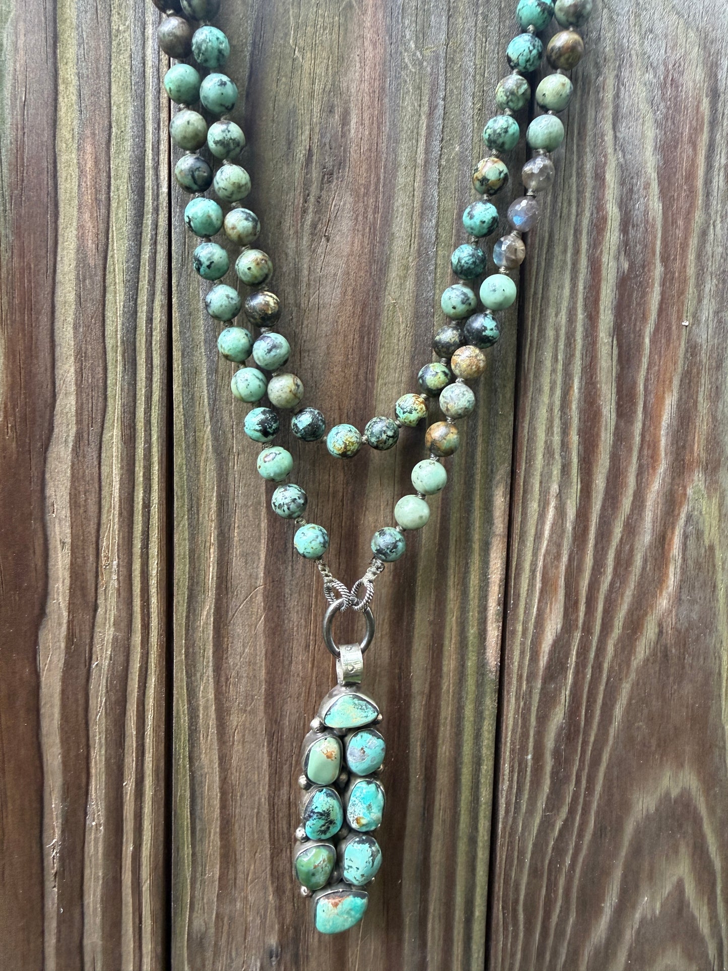 Green turquoise knotted necklace with Tibetan turquoise (removable) pendant. 34.25”.