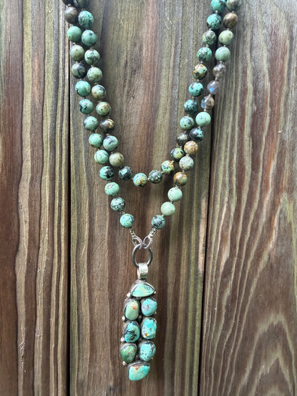 Green turquoise knotted necklace with Tibetan turquoise (removable) pendant. 34.25”.