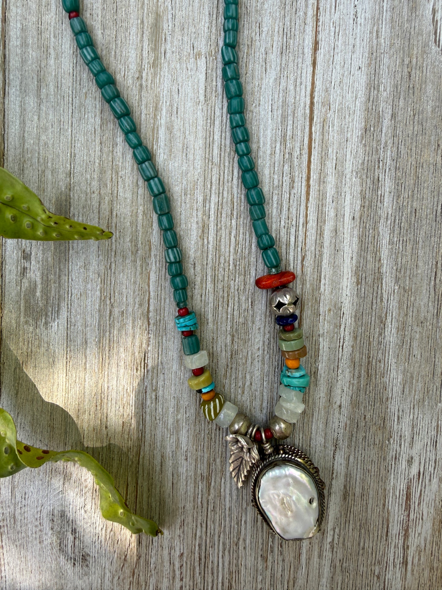 Pearl pendant on trade beads, moonstone, turquoise, coral, and fine silver accents necklace. 17.5”