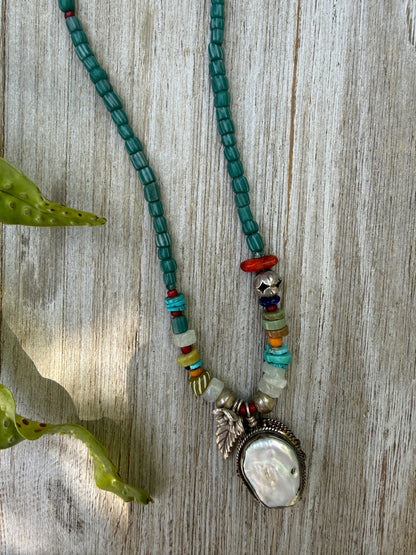 Pearl pendant on trade beads, moonstone, turquoise, coral, and fine silver accents necklace. 17.5”