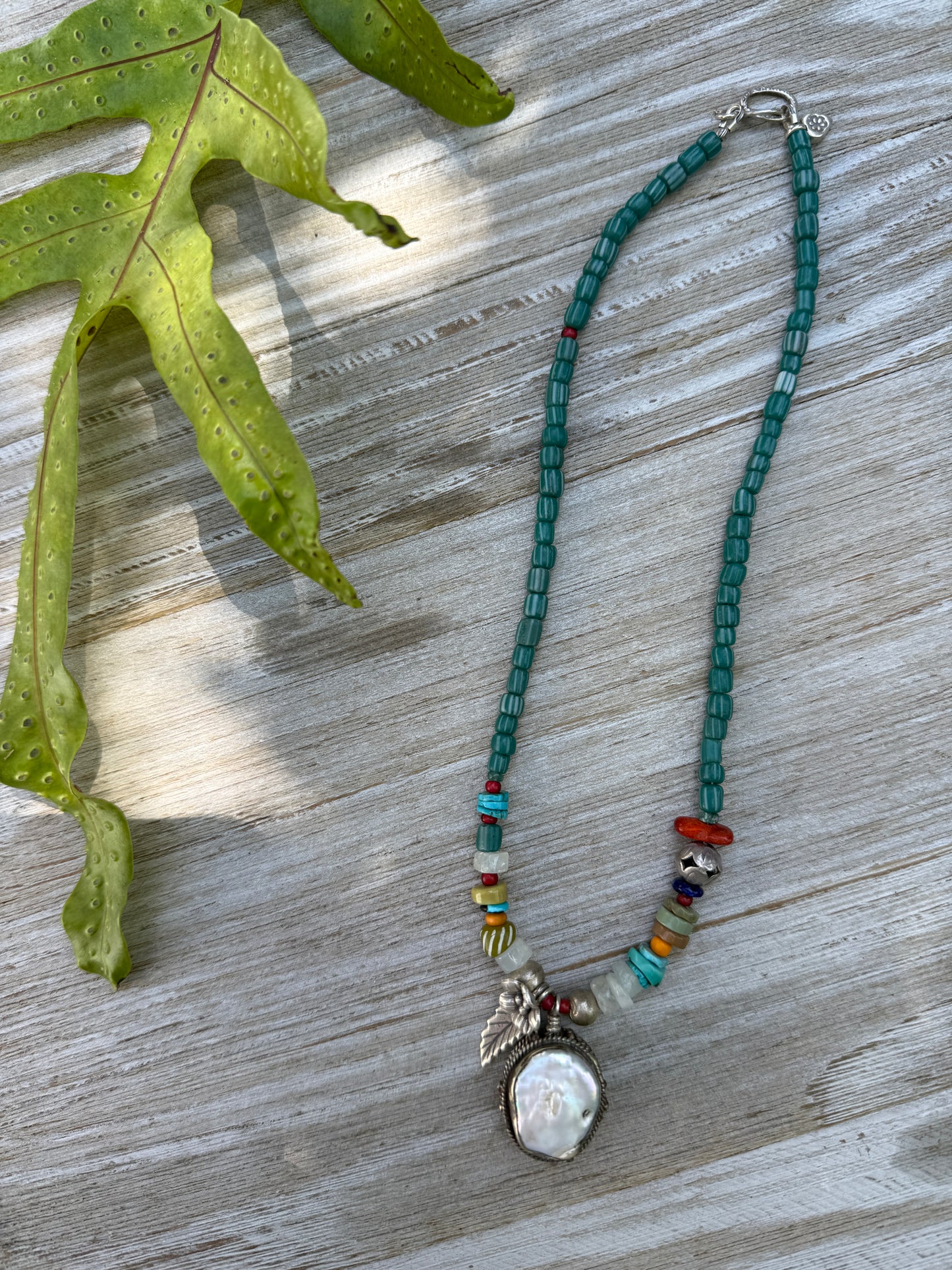 Pearl pendant on trade beads, moonstone, turquoise, coral, and fine silver accents necklace. 17.5”