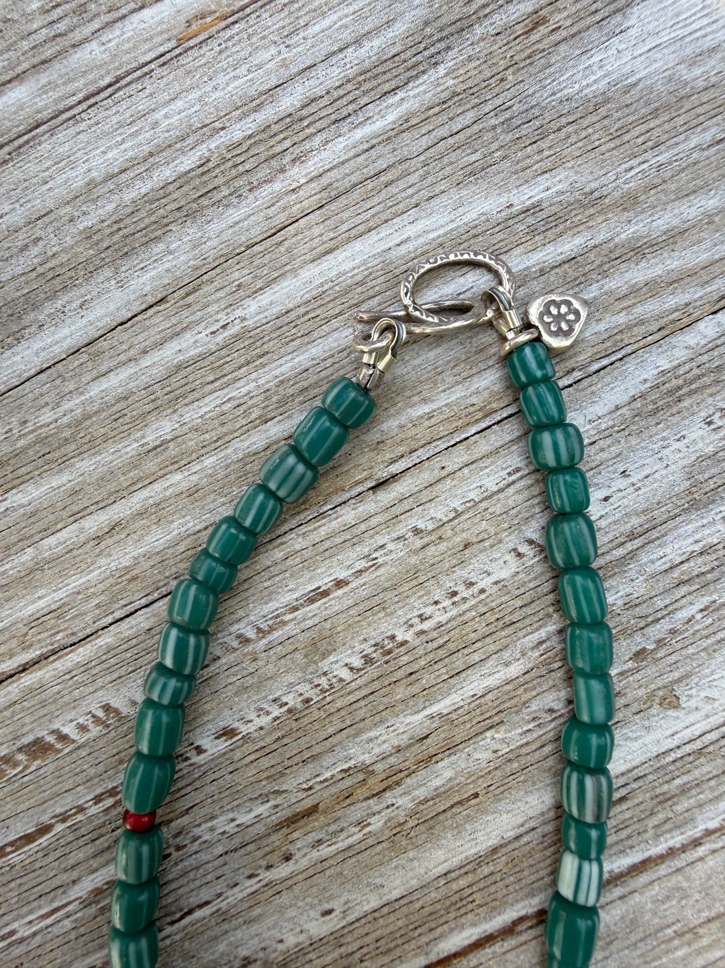 Pearl pendant on trade beads, moonstone, turquoise, coral, and fine silver accents necklace. 17.5”