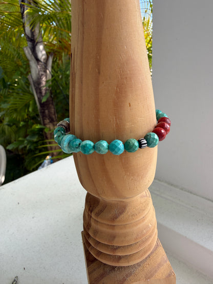 Simplicity in turquoise, fine silver, and broom coral with one trade bead. Stretch bracelet. 6.5”