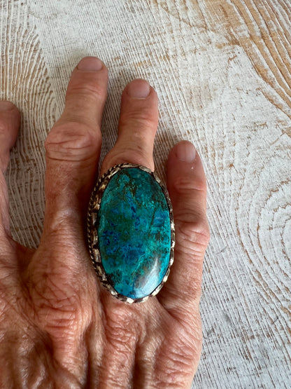 Large turquoise ring with blue and brown veins. Adjustable.