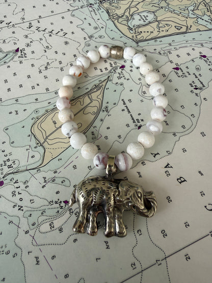 Tibetan bronze elephant on peach blossom agates stretch stack bracelet. 6.5”