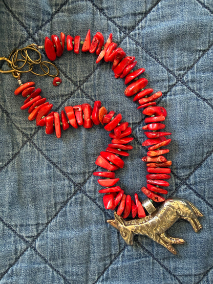 Fun red broom coral and turquoise necklace with donkey pendant. 18.5-23”
