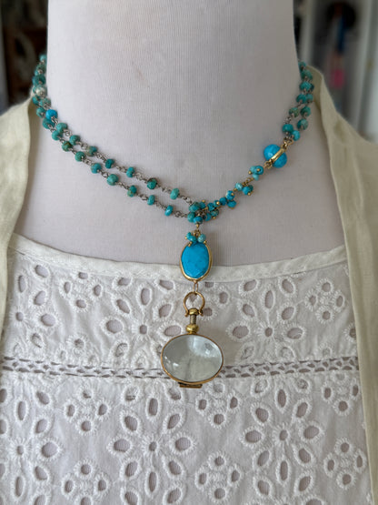 Turquoise rosary style chain with turquoise and gold accent pieces and brass locket necklace.