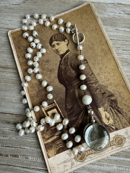 Pearl and sterling locket Y necklace.