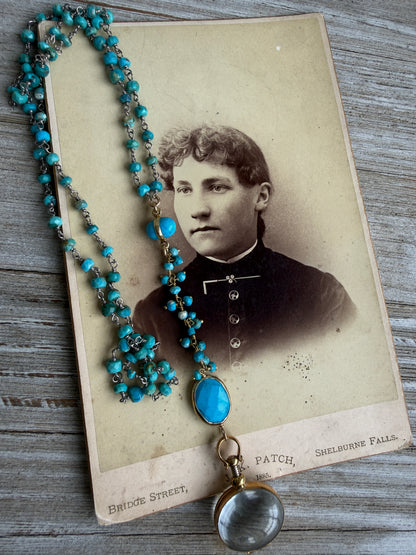 Turquoise rosary style chain with turquoise and gold accent pieces and brass locket necklace.