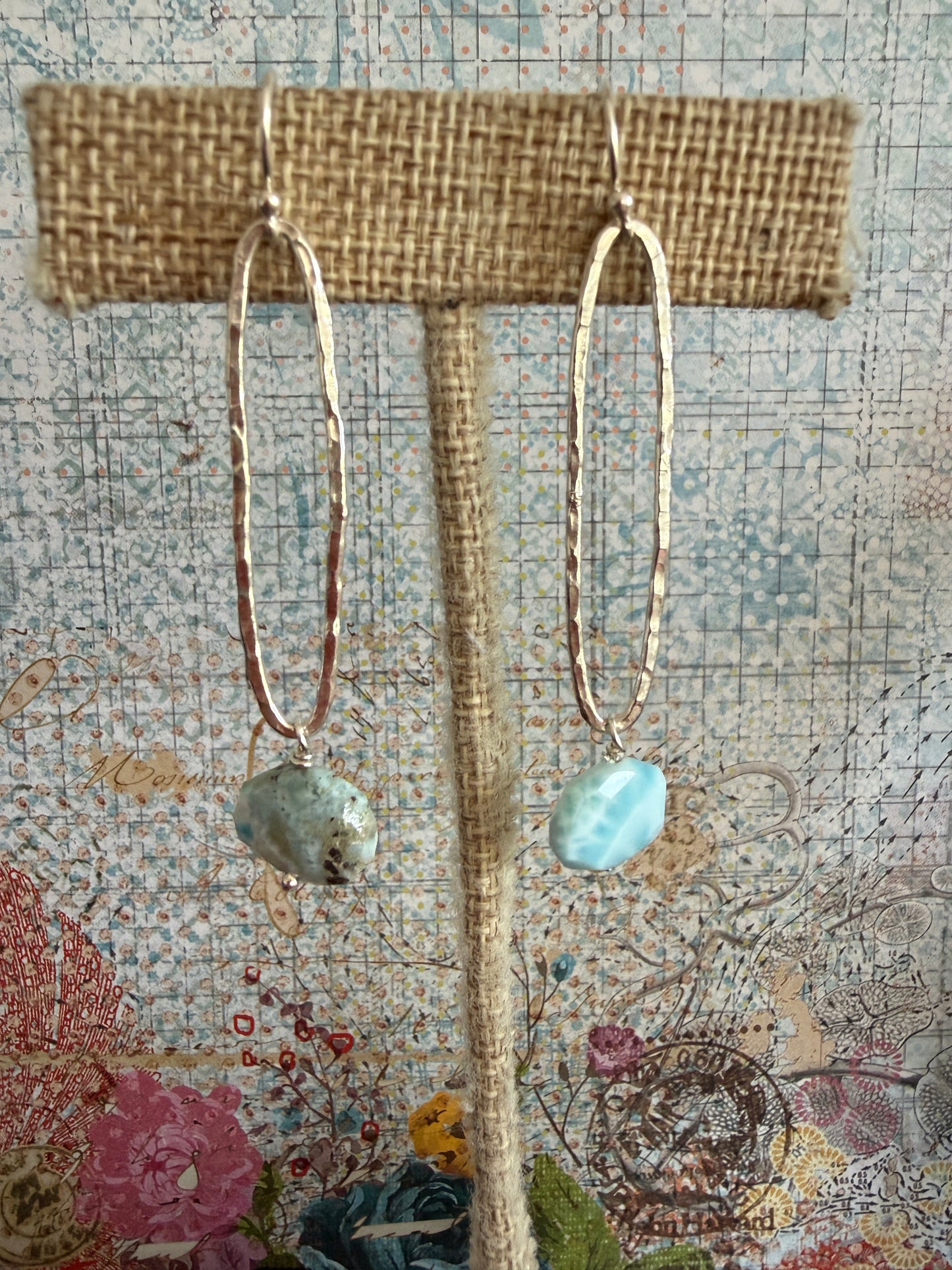 Larimar stones on fine silver elongated oval hoop earrings.