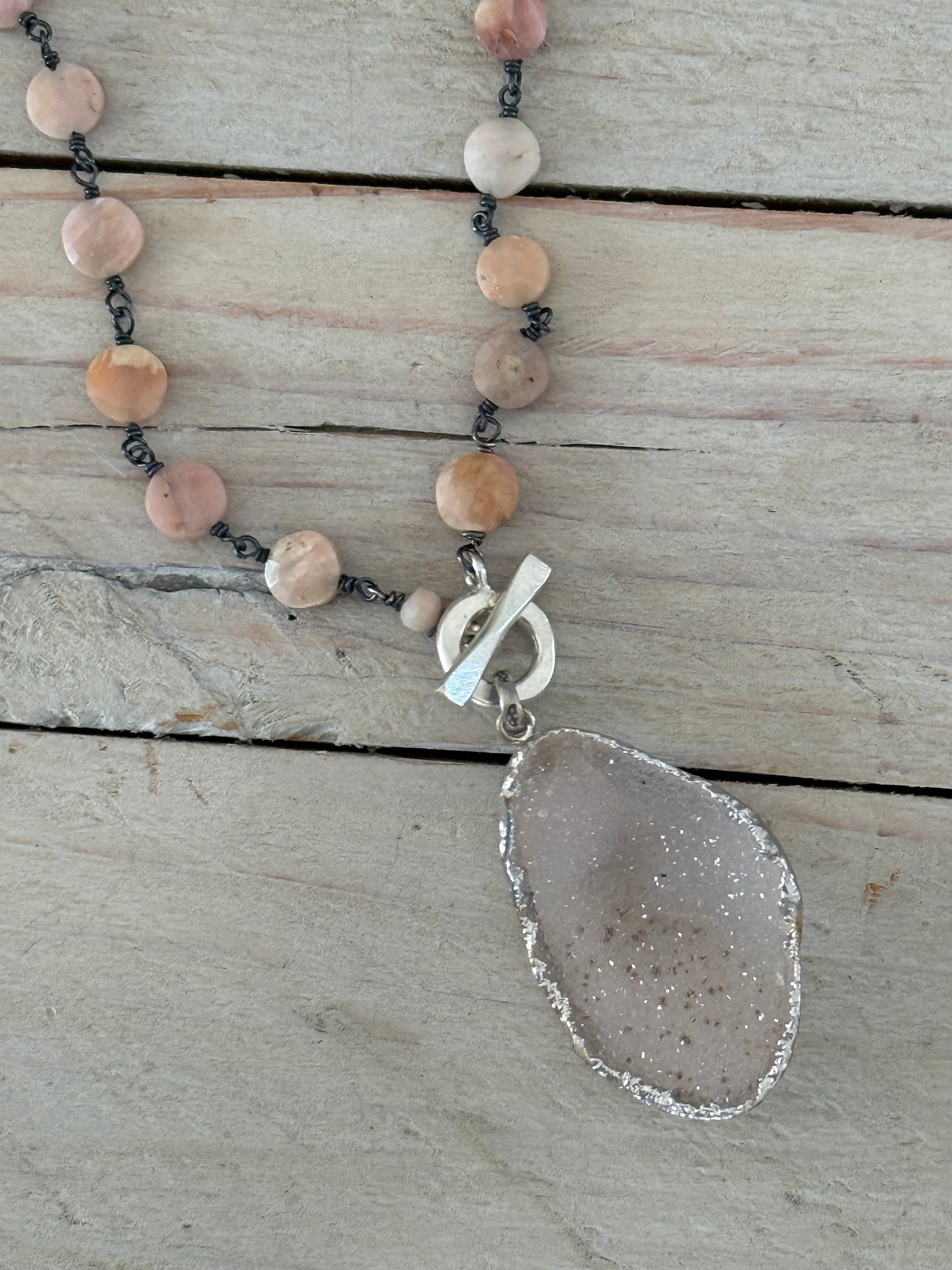 Pale pink druzie on pink Peruvian Opal wire-wrapped coins. Front fine silver toggle necklace.