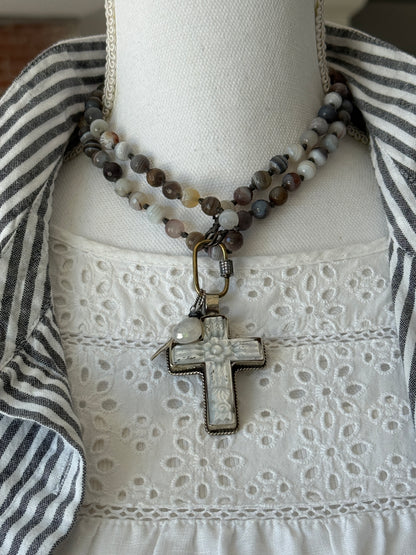 Carved Tibetan Mother of Pearl cross on knotted, faceted Botswana agates necklace.