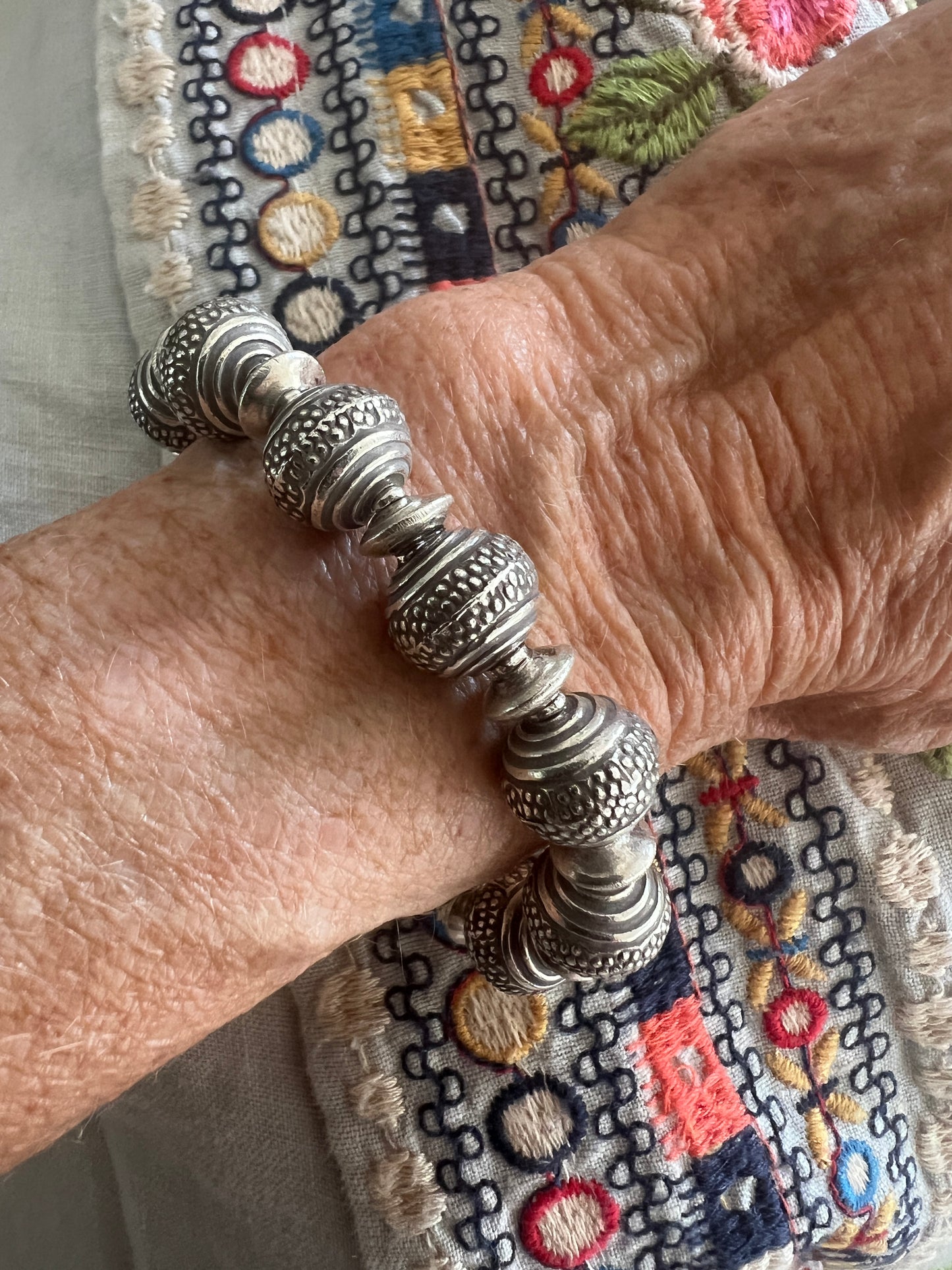 Fun, textured fine silver rounds stretch bracelet. Small (6”)