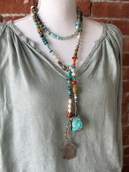 57” of turquoise Amazonite, Jasper, larimar, jade, riverstone, trade beads, Ethiopian silver, broom coral, and others lariat necklace with sterling hamsa and turquoise necklace.