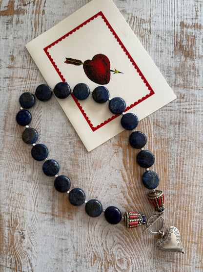 Lapis lazuli coins with Tibetan lapis and coral inlay focal beads necklace. Fine silver toggle clasp and heart. 18”
