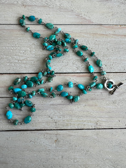 Delicate turquoise chain with toggle clasp. 32” long.